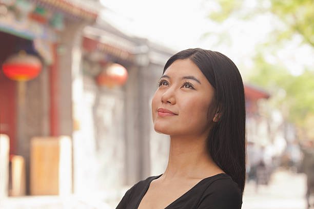 istock Young Woman smiling looking up 188118123