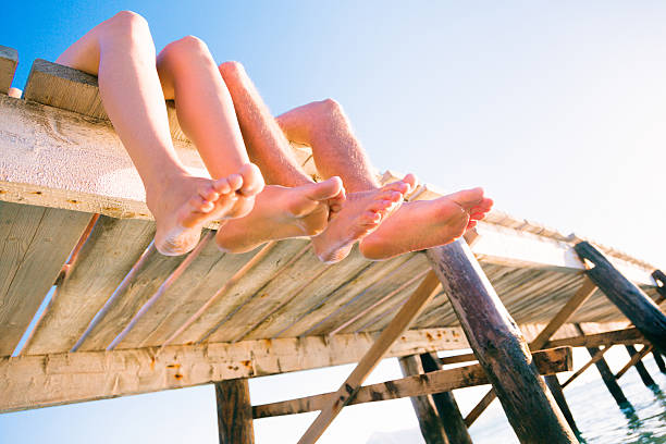 istock young couple by the sea 188119878
