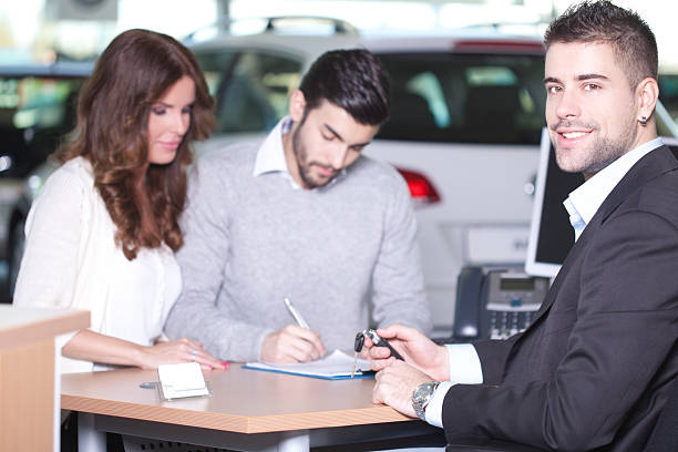istock Couple buying car 188125694