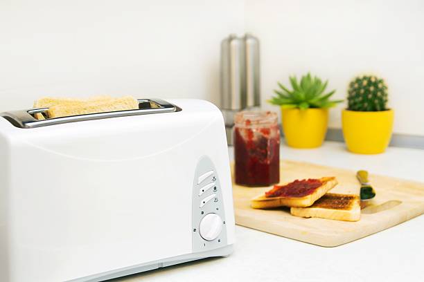 istock Breakfast prepare. Toaster and toast with jam in modern kitchen 188125849