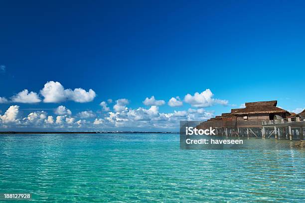 Beautiful Beach With Water Bungalows Stock Photo - Download Image Now - Beach, Blue, Bungalow