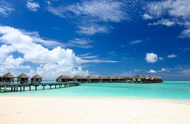 istock Beautiful beach with water bungalows 188133047