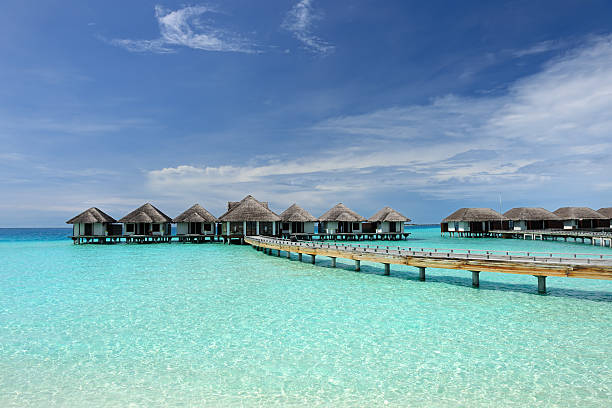 istock Beautiful beach with water bungalows 188133244