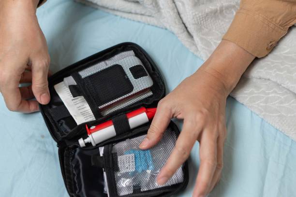 istock A woman's hand checking her blood sugar level with a glucometer by herself at her home. 1881378471