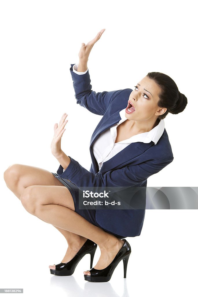 Attractive business woman in a crouch. Attractive business woman in a crouch. isolated on white. Adult Stock Photo