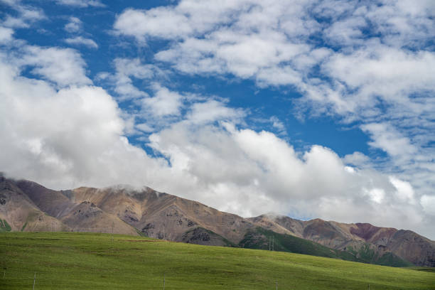 Plateau meadows and mountains under cloudy conditions
