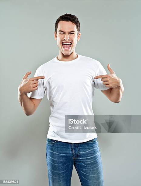 Excited Young Man Stock Photo - Download Image Now - Men, T-Shirt, Pointing