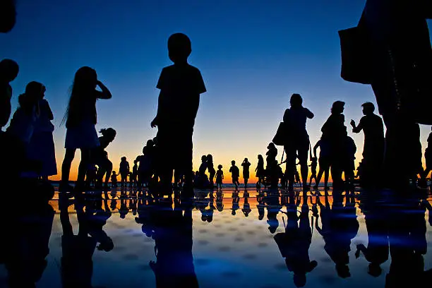 Photo of People reflections on colorful sunset