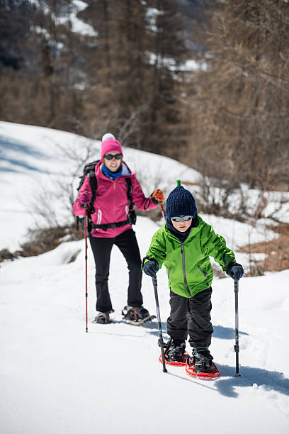 istock Mother and Son Snowshoeing 188142072