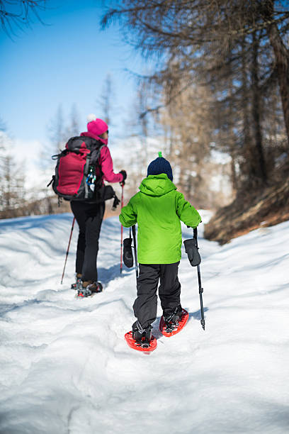 istock Mother and Son Snowshoeing 188142086