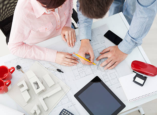 istock Group of architects working in an office 188143168