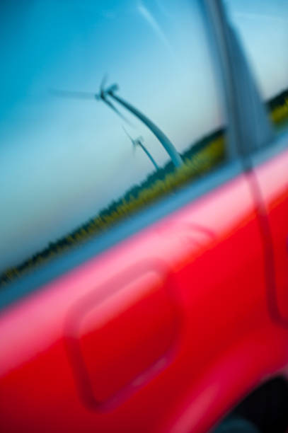 istock red car stands next to the field 188143965