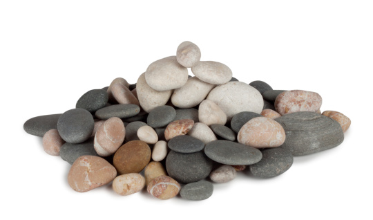 Bunch of round sea pebbles isolated on white background