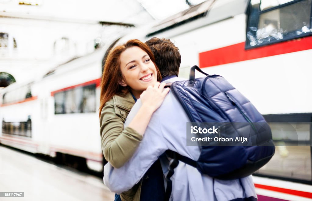 Couple embracing on station platform 20-29 Years Stock Photo