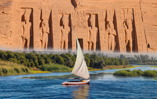 Beautiful Nile scenery with sailboat in the Nile on the way to The Front of the Abu Simbel Temple - Egypt, Africa