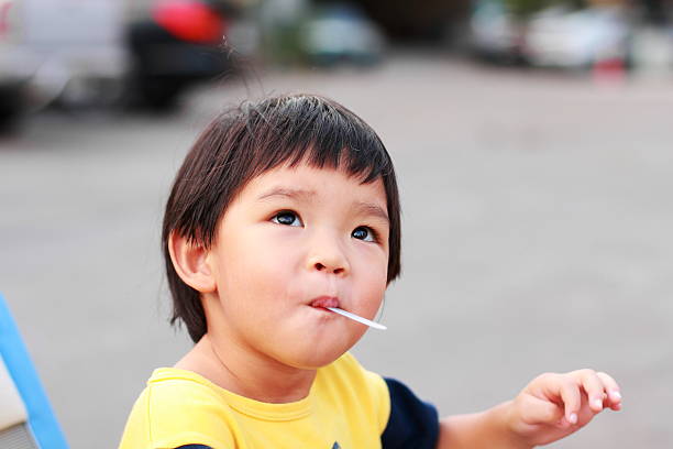 istock Portrait a little boy eating 188151011