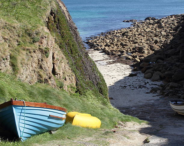 Boats on Causeway of Porthgwarra stock photo