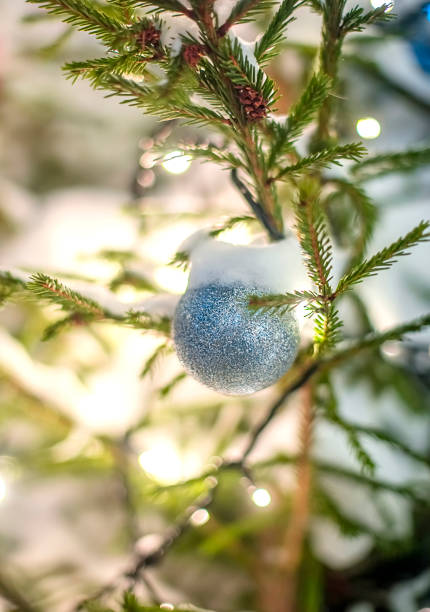 istock Silver ball on a Christmas tree on the street 1881571592