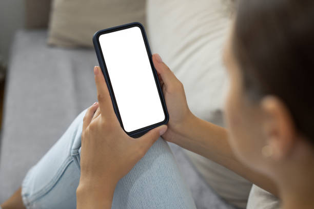 istock Woman using her phone at home 1881584712