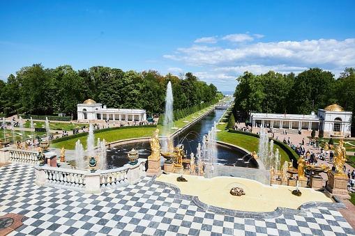 Peterfof, Russia - May 29, 2021: Fountains in the park in front of the Grand Peterhof Palace. Architecture and sculpture of the 18th century