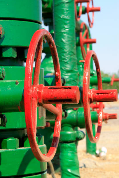 istock green petroleum machinery and red handwheel 1881636126