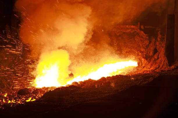 istock hot molten iron flowing from blast furnace 1881660528