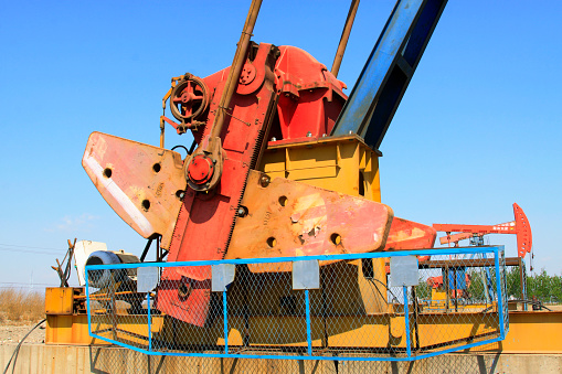 CAOFEIDIAN - MAY 2: crank balanced beam pumping unit in the JiDong oilfield, on may 2, 2014, caofeidian, hebei province, China.