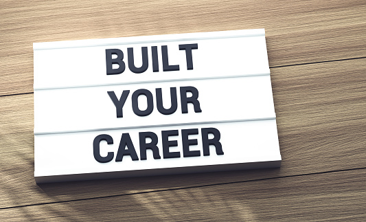 Built Your Career Lightbox On The Wood Table With Tree Shadow.