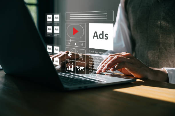 Young man using laptop with Ads dashboard digital marketing strategy analysis for branding.