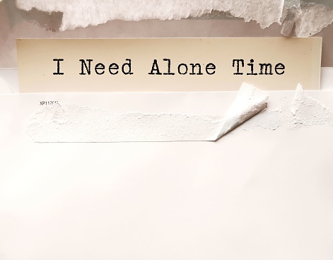 Paper in envelope written ALONE TIME, concept of being around other less, having time to give chance to break free from social pressures,live with solitude, mindfulness and have positive experiences with yourself