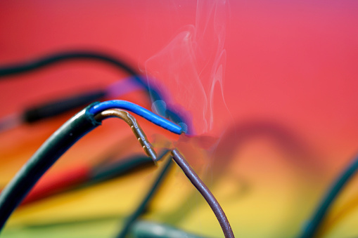 Electric wire and smoke is meant to symbolize blown insulation or overheating
