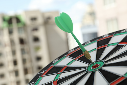 Target, dartboard, hitting the center. On the street.