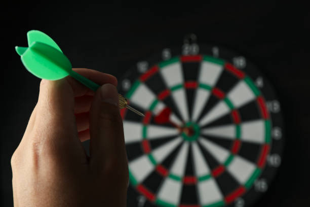 istock Darts, hitting the target, with wires, on a dark background. 1881775236