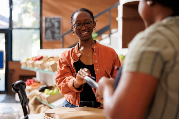 istock Happy woman using card for eco payment 1881777041