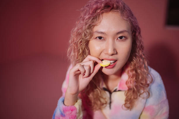 istock Woman biting a gummy candy 1881777563