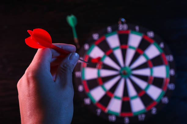 istock Darts, hitting the target, with wires, on a dark background. 1881778598