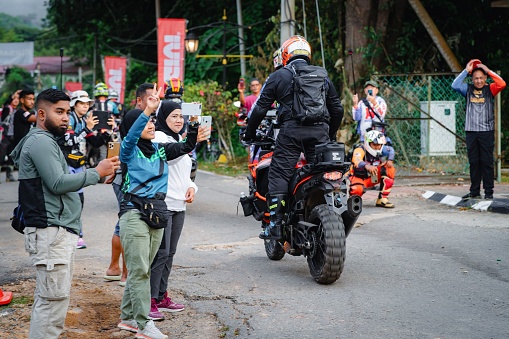 Pahang, Malaysia – September 24, 2022: An Enduro biker at the starting point during practice.