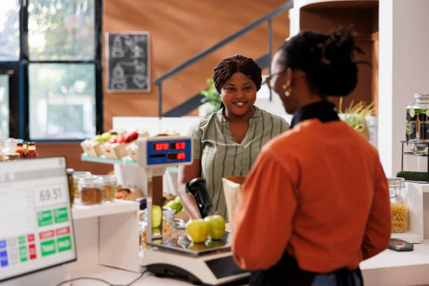 istock Customer assisted by vendor at counter 1881792738