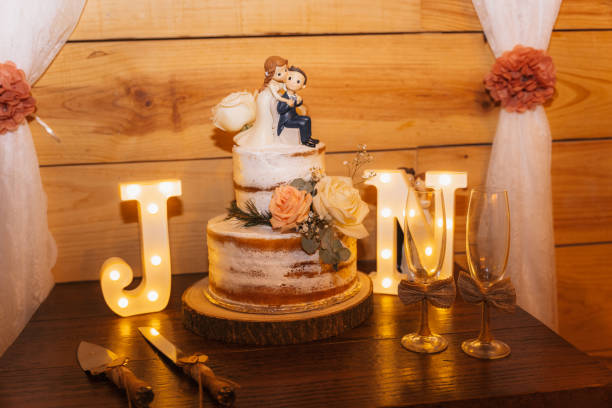 istock Wedding cake on a wooden background at a beautiful wedding 1881812221