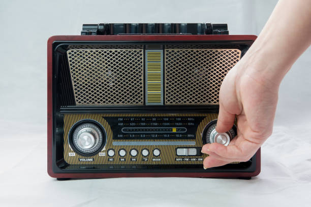 istock A Female Fingers Tuning the Frequency on an Old Vintage Analog Receiver 1881825149