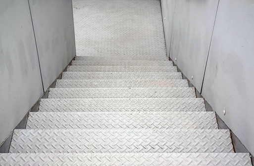 White staircase steel floor plate texture. 
Abstract black metal sheet stair