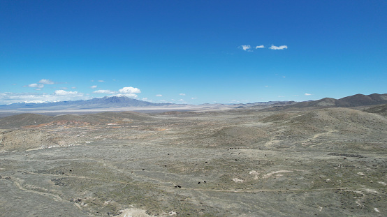 An aerial view of the Nevada desert in the northwest Winnemucca area against a vivid blue sky