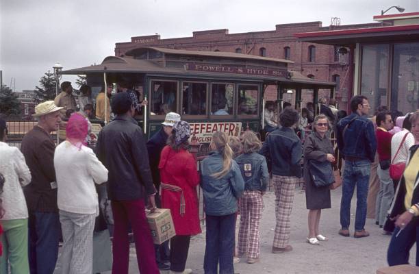 San Francisco, California, USA, 1975. People queuing at a ticket booth for the cable car.