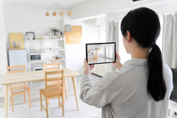 istock A woman using an AR app to simulate furniture placement 1881896529