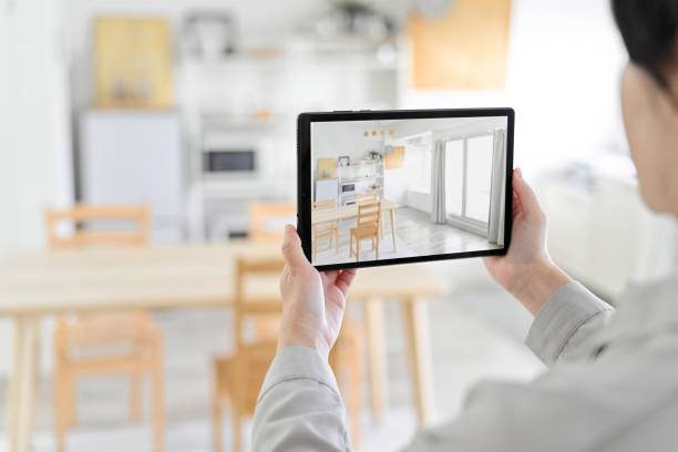 istock A woman using an AR app to simulate furniture placement 1881896538