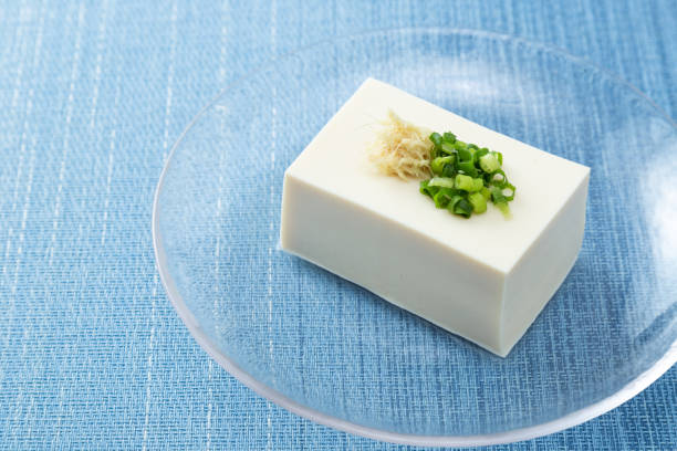 istock Tofu on a blue background. 1881952160