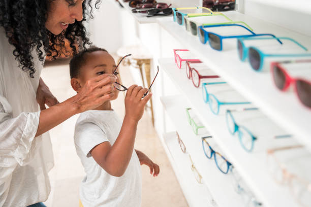 istock Mixed Race Boy's Stylish Eyeglass Fitting Session 1881958513