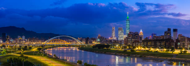Taipei skyscraper cityscape glittering over Keelung River panorama Taiwan