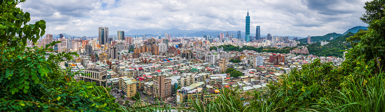 The iconic view of  Taipei downtown skyscrapers overlooking the crowded cityscape of Taiwan’s vibrant capital city.