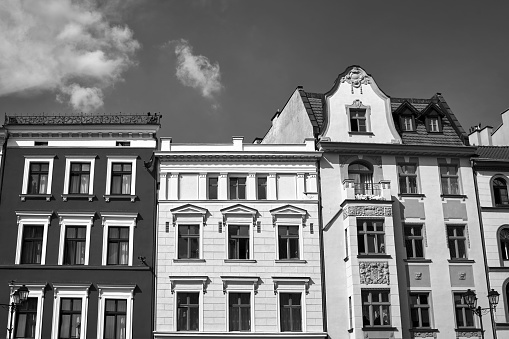 facades of a historic tenement houses in the city of Torun, Poland